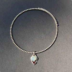 Sterling silver cuff necklace with pendant.